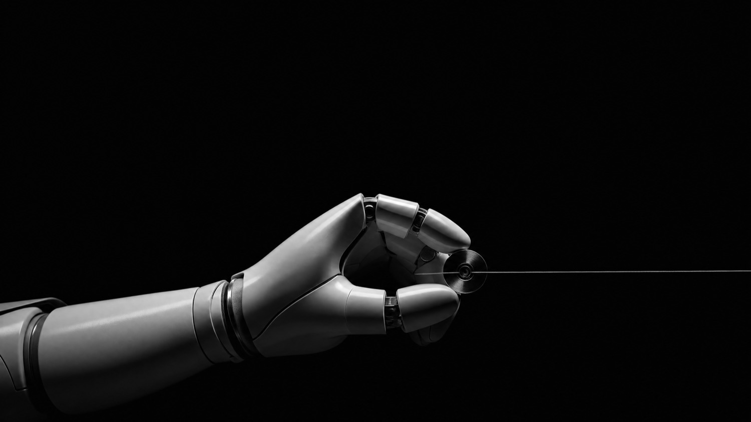 A robotic hand, monochrome studio study, reaching to the right.